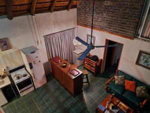 an overhead view of a living room with a table and a refrigerator at Carpe Diem in Marloth Park