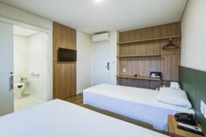 Postel nebo postele na pokoji v ubytování Viale Iguassu Hotel + 22 fotografií