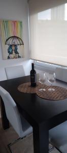 a black table with two wine glasses on it at Estupendo Apartamento en Puerto Madero in Buenos Aires