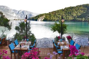 a table and chairs with a view of a lake at Sundia By Liberty Suncity in Oludeniz