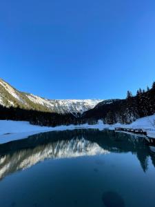 a view of a lake in the snow at Résidence LE ROC SABAL - Courchevel 1650 in Courchevel +7 photos
