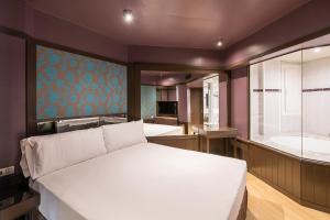 Posteľ alebo postele v izbe v ubytovaní Hotel Punt 14