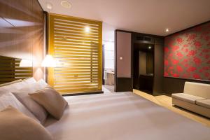 Posteľ alebo postele v izbe v ubytovaní Hotel Punt 14