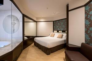 Posteľ alebo postele v izbe v ubytovaní Hotel Punt 14