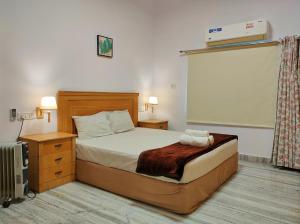Katil atau katil-katil dalam bilik di Homestay at Bungalow 97 Ajmer