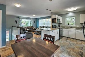 a kitchen and living room with a wooden table at Three Bedroom, California King bed in Colorado Springs