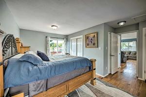 a bedroom with a bed with a blue comforter at Three Bedroom, California King bed in Colorado Springs