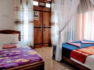 Katil atau katil-katil dalam bilik di New Mount Villa