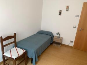 A bed or beds in a room at Angeli Dolomiti House2