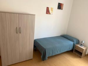 A bed or beds in a room at Angeli Dolomiti House2
