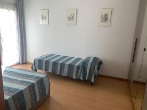 A bed or beds in a room at Angeli Dolomiti House2