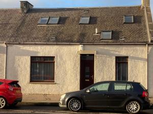 two cars parked in front of a house at 30 College Street, Buckhaven, Leven, Fife, KY81JX in Buckhaven