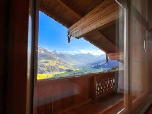 a view from a window of a mountain view at Schulhaus Tirol in Zell am Ziller