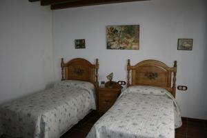 Cama o camas de una habitación en Casa Lentegí