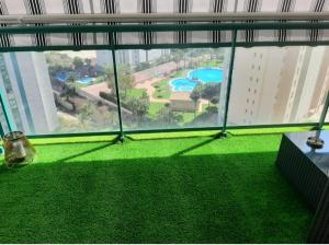 Basen w obiekcie Precioso apartamento con piscina cerca de la playa lub w pobliżu