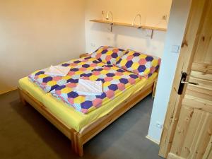 Postel nebo postele na pokoji v ubytování Apartmány Pod Kopcem