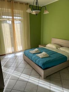 Ένα ή περισσότερα κρεβάτια σε δωμάτιο στο Orio Relax 24h Airport 1 - 3 minute from arrival by bus