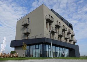 a building with balconies on the side of it at Marida Hotel in Satu Mare