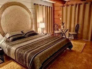 Postelja oz. postelje v sobi nastanitve Domaine Baie Mud