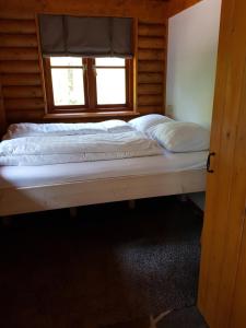 A bed or beds in a room at Lutterlodge