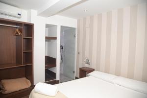 Ein Bett oder Betten in einem Zimmer der Unterkunft Cordoba Carpe Diem