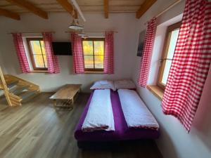 Postel nebo postele na pokoji v ubytování Apartmány Pod Kopcem