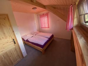 Postel nebo postele na pokoji v ubytování Apartmány Pod Kopcem