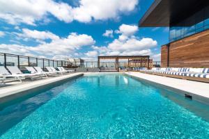 a swimming pool on the roof of a building at Aurelien Spacious Apartments in the Heart of Gold Coast in Chicago