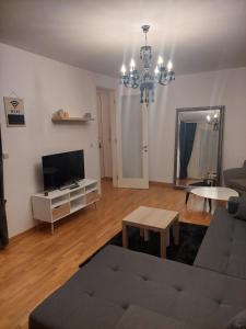 TV a/nebo společenská místnost v ubytování Apartment Belville, Suncokret 26