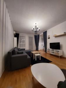 TV a/nebo společenská místnost v ubytování Apartment Belville, Suncokret 26