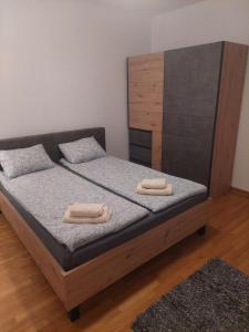 Postel nebo postele na pokoji v ubytování Apartment Belville, Suncokret 26