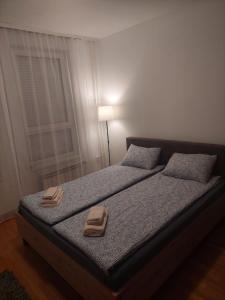 Postel nebo postele na pokoji v ubytování Apartment Belville, Suncokret 26