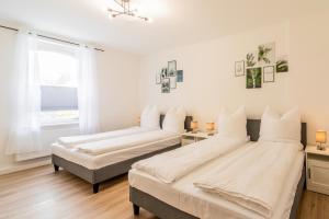 Postel nebo postele na pokoji v ubytování Große 3-Zimmer Wohnung - zentral-Coburg - kostenloser Parkplatz