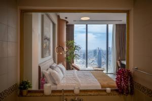 Postel nebo postele na pokoji v ubytování Apartment Riyadh Rafal Tower 93