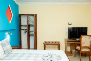 TV a/nebo společenská místnost v ubytování Amazone Hotel Tulear