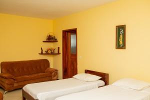 Postel nebo postele na pokoji v ubytování Amazone Hotel Tulear