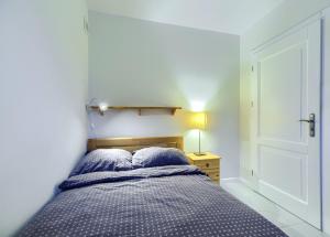 A bed or beds in a room at Studio Gdańsk - Oliwa