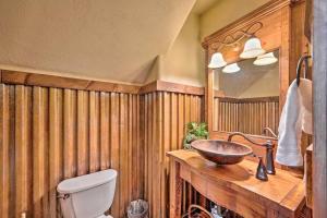 a wooden bathroom with a sink and a toilet at Timbercrest in McCall +33 photos