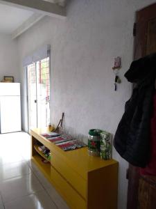 a kitchen with a yellow dresser in a room at Casa en La Esmeralda Uruguay in La Esmeralda 