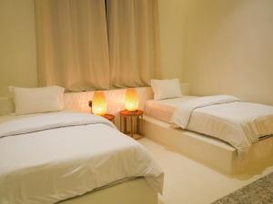 Uma cama ou camas num quarto em Pool Villa Jebel Jais