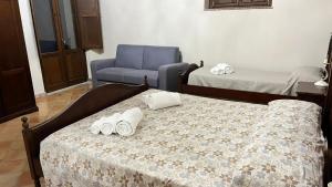 En eller flere senge i et værelse på Casa Vacanze Nicola e Lina