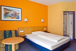 Postel nebo postele na pokoji v ubytování Hotel Strohofer + 28 fotografií