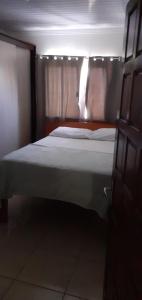 Postel nebo postele na pokoji v ubytování Casa de praia