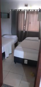 Postel nebo postele na pokoji v ubytování Casa de praia