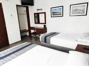 Postel nebo postele na pokoji v ubytování Hotel Star