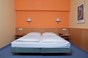 Posteľ alebo postele v izbe v ubytovaní Hotel Strohofer