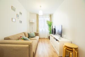 TV a/nebo společenská místnost v ubytování CARTAGENAFLATS, Apartamentos Anfiteatro Romano 4B