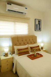 Postel nebo postele na pokoji v ubytování Suite Ejecutiva 2F A 12Min Malecon 2000 GYE