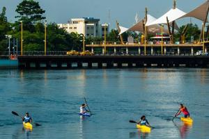 a group of people in kayaks in the water at Condominio Charito Suite 2G a 12 Min Malecon 2000 in Guayaquil