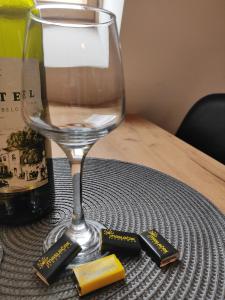 a wine glass sitting on top of a table at Apartman Maslacak in Divčibare